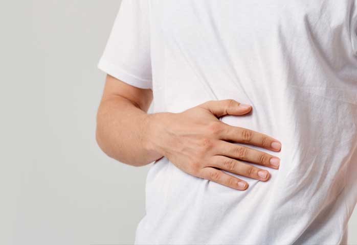 man holding stomach